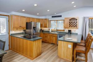 a kitchen with wooden cabinets and a counter top at Grateful Roots in Egg Harbor