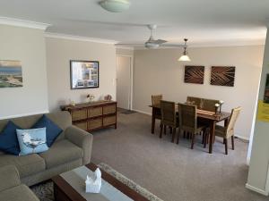 a living room with a couch and a table at Beach Haven Villa in North Haven