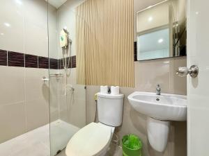 a bathroom with a toilet and a sink and a shower at Chalong - Studio Service Apartment - Phoomjai in Ban Klang +60 photos
