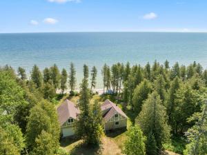 an aerial view of a house and the ocean at Tranquility Bay Getaway by Simple Life Rentals in Sister Bay