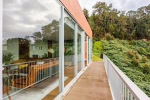 an empty balcony with glass doors on a house at Keam House in Santana