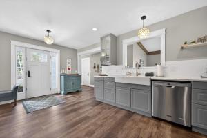 a large kitchen with a sink and a counter at High Garden by Simple Life Rentals in Sister Bay