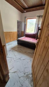 an empty room with a window and a door at Ivory Nest Villa in Chamba
