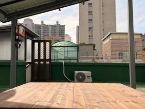 a speaker sitting on a deck with a building at sinae stayG in Seoul