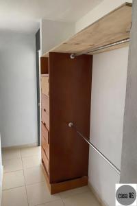 a room with a closet with a wooden door at Habitación 2 Pitaya Casa RE in Tehuacán +17 photos