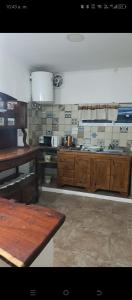 a large kitchen with wooden cabinets in a kitchen at Panambí in Colón