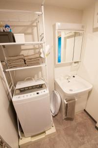 a small bathroom with a stove and a sink at OKU - Nakasendo - in Shiojiri +118 photos