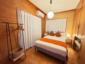 a bedroom with a large bed in a room at Rela More in Ginowan