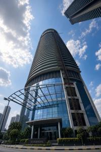 a tall building with scaffolding on the side of it at Nova Spira in Noida