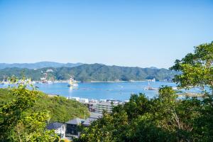 a view of a harbor with boats in the water at Villa LUAR in Minamiawaji