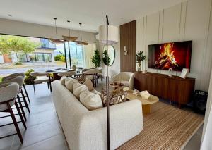 a living room with a couch and a fireplace at Villa Divina in Punta Cana