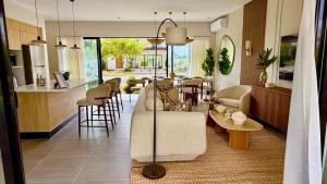 a living room with a couch and a table at Villa Divina in Punta Cana