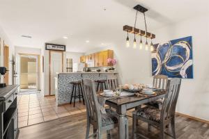a kitchen and dining room with a table and chairs at Emerald Bay Escape with Sunroom in Hollister