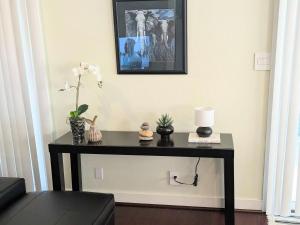 a black table in a room with a picture on the wall at Silicon Valley Stays Casa Dos in Mountain View