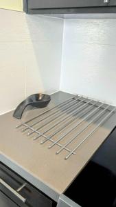 a metal rack on top of an oven at Silicon Valley Stays Casa Dos in Mountain View
