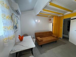 a living room with a couch and a table at Sucriers in Garnier