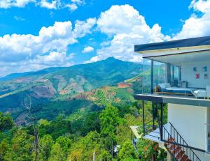 a house with a balcony with a view of mountains at Sky Sakad Sunset at Doi Sakad, Nan in Ban Pha Hu +5 photos