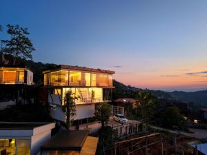 a building with a lot of windows on it at Sky Sakad Sunset at Doi Sakad, Nan in Ban Pha Hu