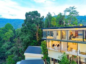a building with a view of the forest at Sky Sakad Sunset at Doi Sakad, Nan in Ban Pha Hu