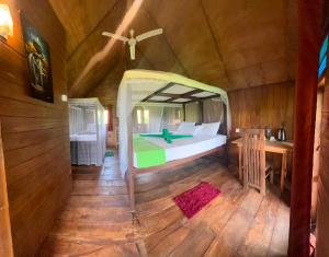 a bedroom with a bed in a room at Elegant Elephant Tree House Sigiiriya in Sigiriya