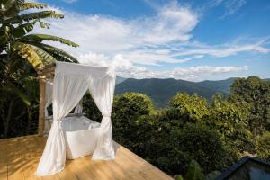 a white tent sitting on top of a deck at 4sky in Ban Kai Noi