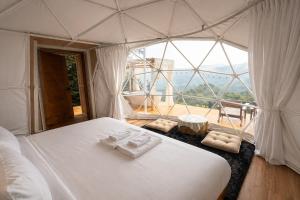 a white bed in a room with a large window at 4sky in Ban Kai Noi +44 photos