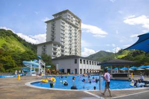 a group of people in a pool at a resort at Elysian Gangchon Resort in Chuncheon