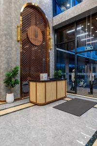 a lobby of a building with a reception desk at Lucent Home in Gò Công +94 photos