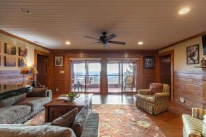 a living room with a couch and a ceiling fan at Alpine Vista in Lenoir