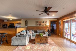 a living room with a couch and a ceiling fan at Alpine Vista in Lenoir