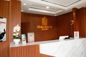 a lobby with a reception desk and a sign on a wall at Nimo Resort Ciater in Ciater +75 photos