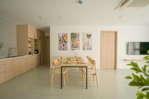 a dining room with a table and chairs at TS Apartment in Hanoi