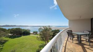 a balcony with a table and chairs and the ocean at Gemini Resort 55 Stunning Ocean Views in Golden Beach