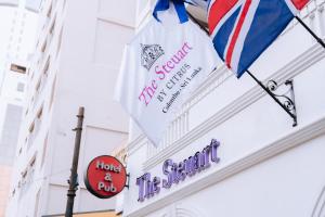 a sign on the side of a building with an umbrella at The Steuart by Citrus in Colombo