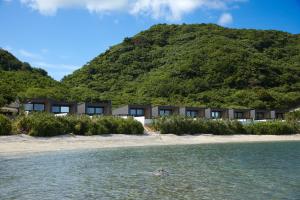 a view of the hotel from the beach at Mare Blu Amami in Tatsugo