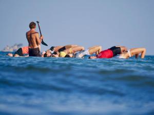 a group of people on the water in the ocean at The TALAY in Ban Na Tai