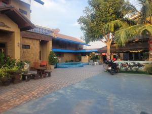 a building with a motorcycle parked in front of it at Hua hin pool view in Hua Hin