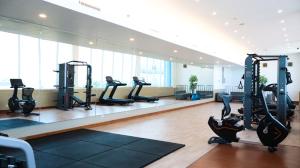 a gym with tread machines and a large window at Hotel Brothers Solo in Solo