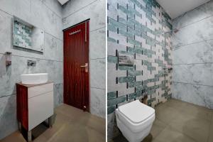 a bathroom with a toilet and a red door at Collection O Kharar Bus Terminal Formerly Hotel Kamboj in Kharar