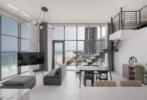 a living room with a view of the ocean at Plott The Gak Yangyang in Yangyang