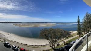 a view of a large body of water with cars parked at Riviere Unit 718 in Golden Beach