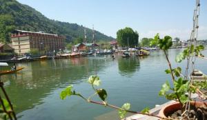 a body of water with boats in it at Houseboat Saleem in Dal Lake