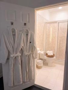 a white bathroom with a shower and a toilet at hotel barmel in Siguatepeque +7 photos