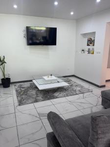 a living room with a couch and a table at Résidence Atoumo in Rivière-Pilote