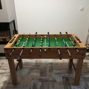 a ping pong table with a green cloth at Chata u tří borovic in Chvalatice