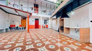 a room with a tiled floor in a building at Casa Largo Katayama in Ruiosucio