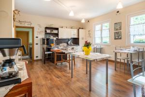 a kitchen and dining room with a table and chairs at B&B La Vecchia Tipografia - Lago D'Idro in Ponte Caffaro