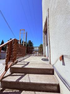 a set of stairs leading up to a building at Wey Stop in K'vemo Alvani