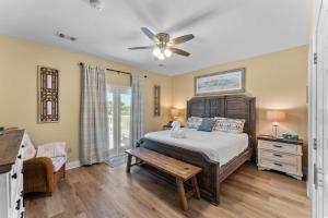 a bedroom with a bed and a ceiling fan at Gulf View Beach Home with Pool in Gulf Shores