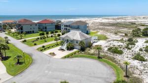 an aerial view of a house next to the beach at Gulf View Beach Home with Pool in Gulf Shores +44 photos